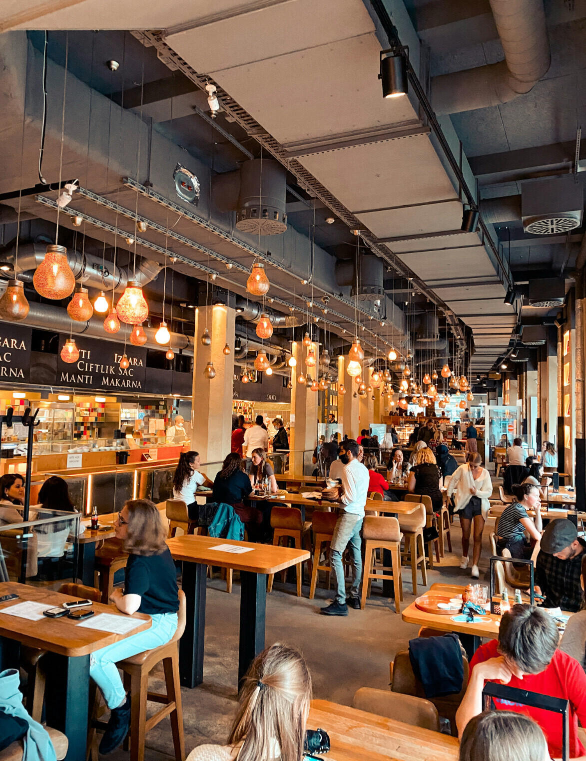 Business owner processing payment with modern POS system